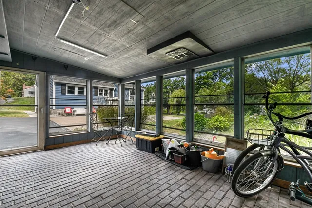 a front view of house with yard and trees around