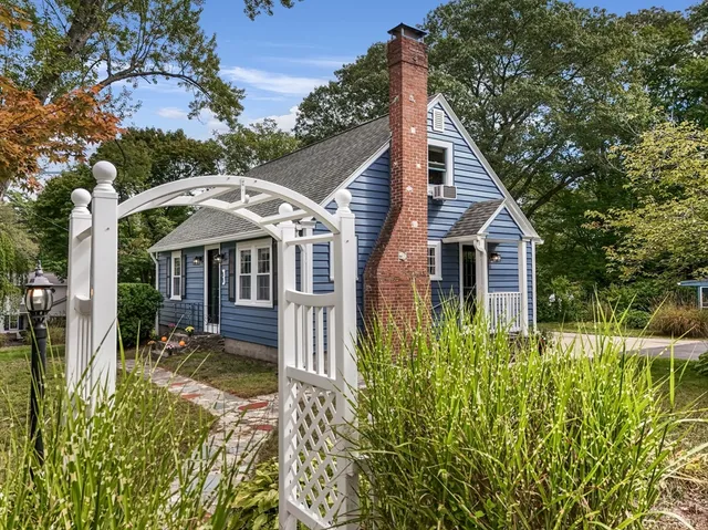an aerial view of residential house with outdoor space and river view