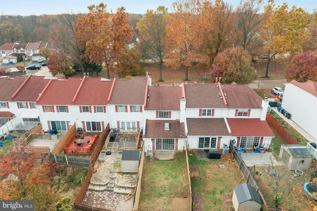 an aerial view of residential houses and trees