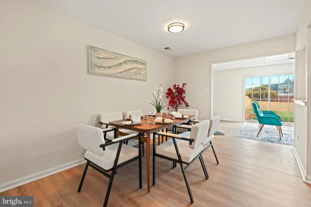 a view of a livingroom with furniture and wooden floor