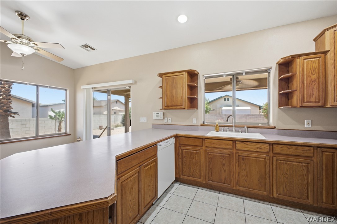 3918 North Eagle Rock Road Kingman, AZ 86409 - Photo 10 of 44 a large kitchen with kitchen island a sink stainless steel appliances and cabinets