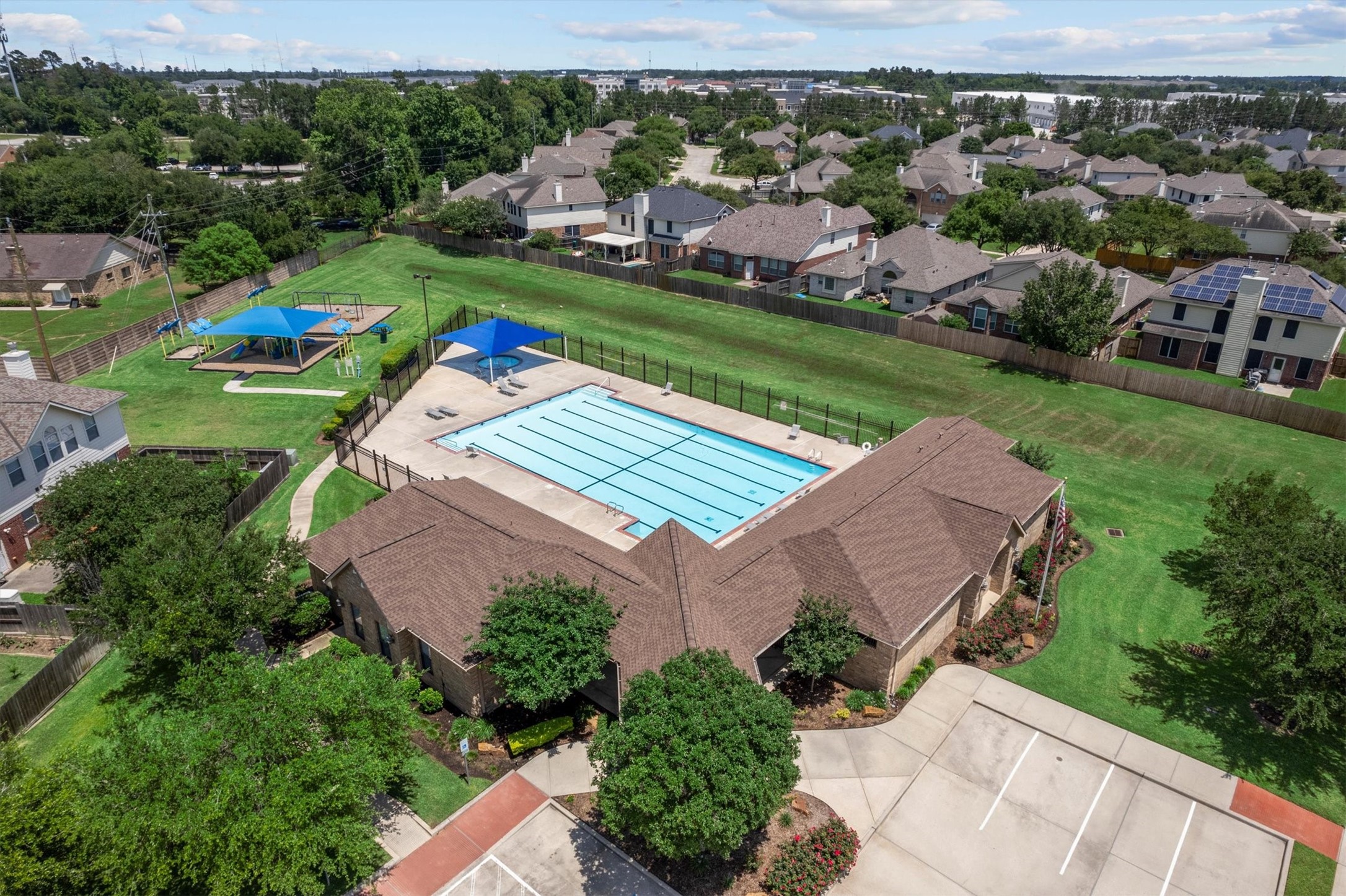 2507 Grayfeather Court Spring, TX 77388 - Photo 34 of 37 Central community area featuring a large swimming pool, shaded seating areas, and playground equipment.