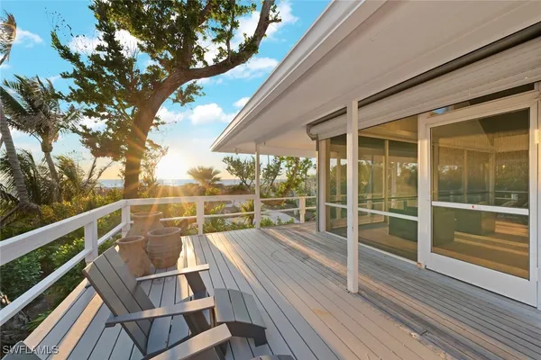 a view of balcony with furniture