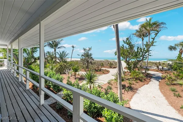 a view of a balcony with wooden floor