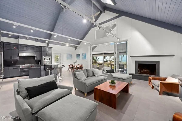 a living room with furniture fireplace and a flat screen tv