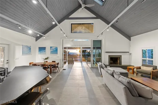 a living room with furniture stove and a fireplace