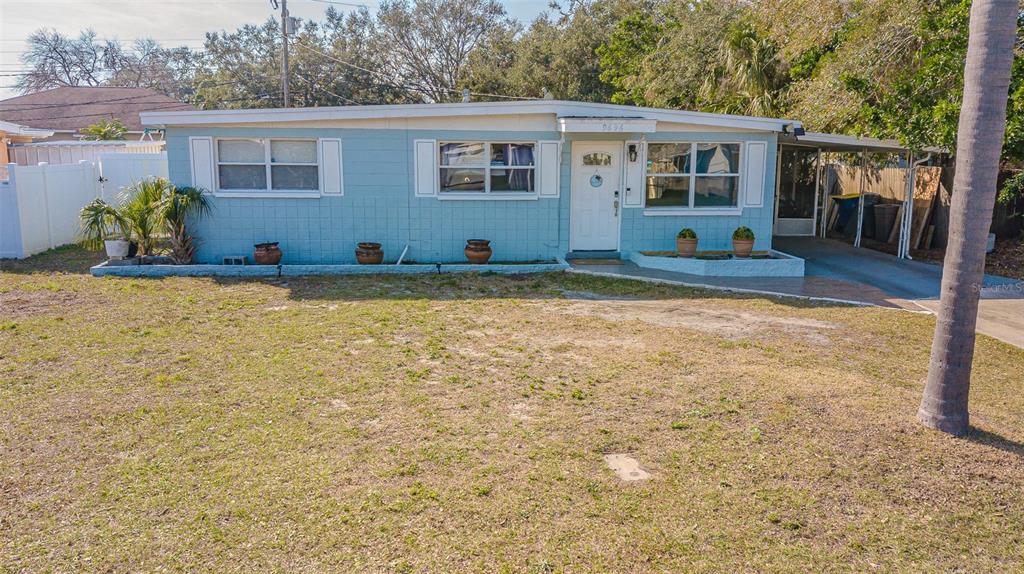9696 Groveland Street Seminole, FL 33772 - Photo 16 of 22 a view of a house with backyard