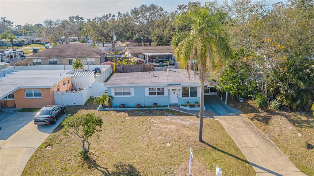 9696 Groveland Street Seminole, FL 33772 - Photo 17 of 22 a aerial view of a house with a yard