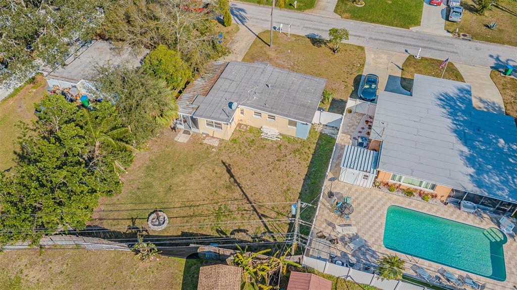 9696 Groveland Street Seminole, FL 33772 - Photo 20 of 22 an aerial view of a house with swimming pool