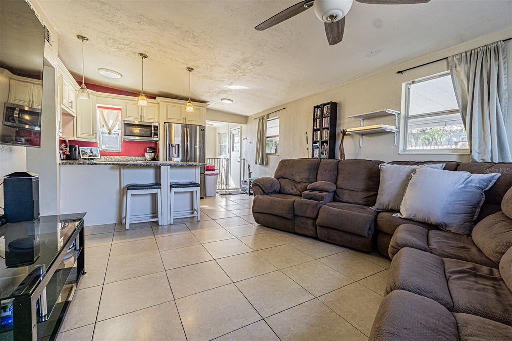 9696 Groveland Street Seminole, FL 33772 - Photo 4 of 22 a living room with furniture and a window