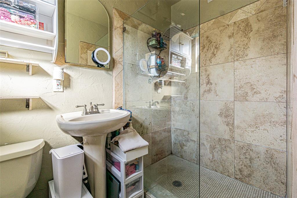 9696 Groveland Street Seminole, FL 33772 - Photo 10 of 22 a bathroom with a sink toilet and shower