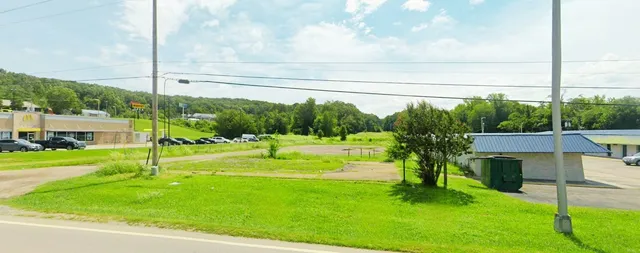 a view of a house and a big yard