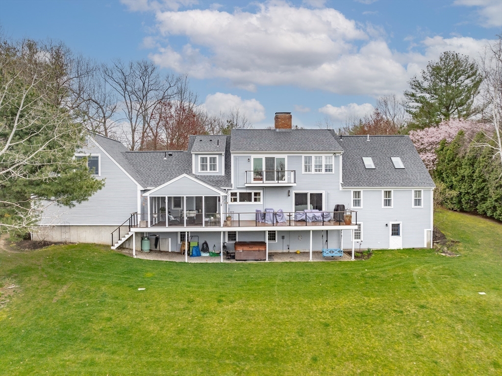 110 Kettle Hole Road Bolton, MA 01740 - Photo 4 of 40 a view of a house with a big yard and large trees