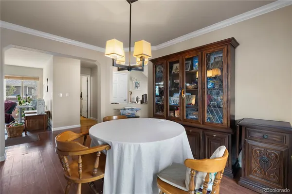 a view of a dining room with furniture window and wooden floor