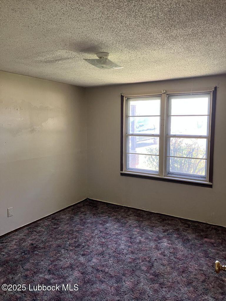 1615 Utica Plainview, TX 79072 - Photo 17 of 26 an empty room with a window