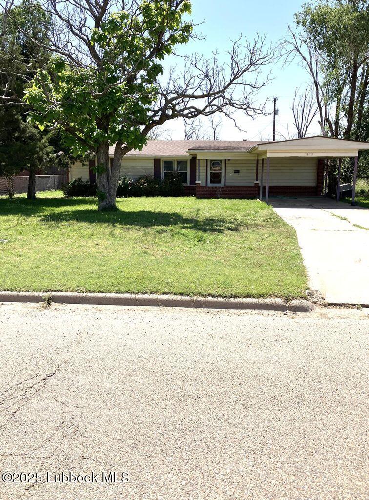 1615 Utica Plainview, TX 79072 - Photo 2 of 26 a view of a house with a yard and sitting area