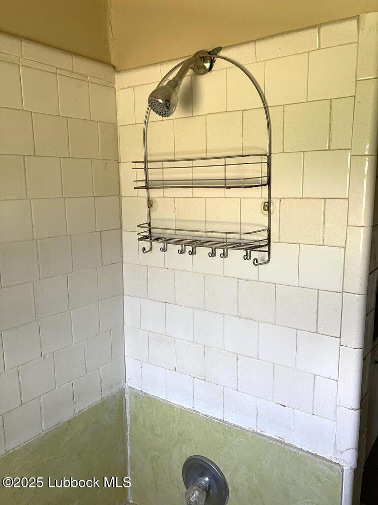 1615 Utica Plainview, TX 79072 - Photo 21 of 26 a bathroom with a shower