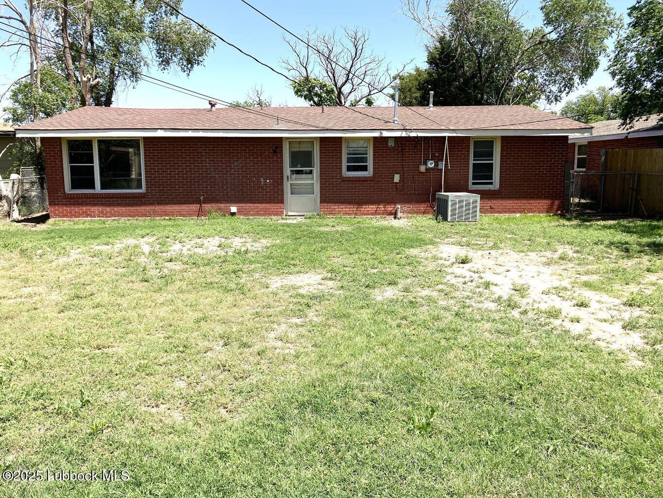 1615 Utica Plainview, TX 79072 - Photo 22 of 26 a front view of house with yard and outdoor seating