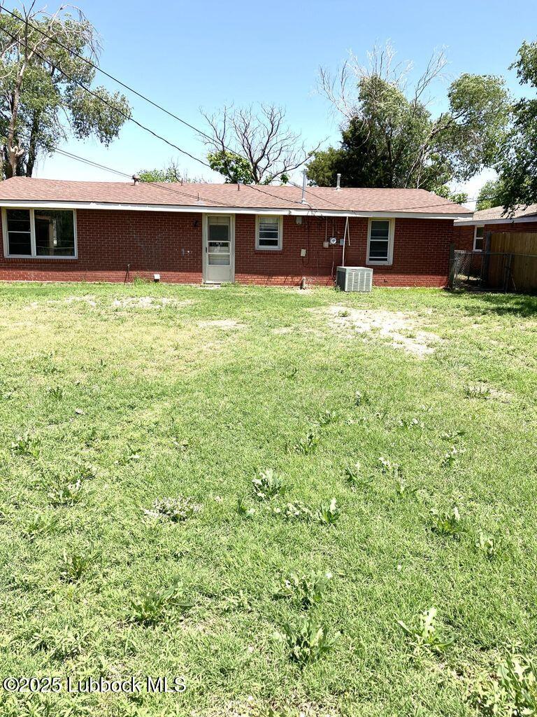 1615 Utica Plainview, TX 79072 - Photo 23 of 26 a view of a house with pool and chairs