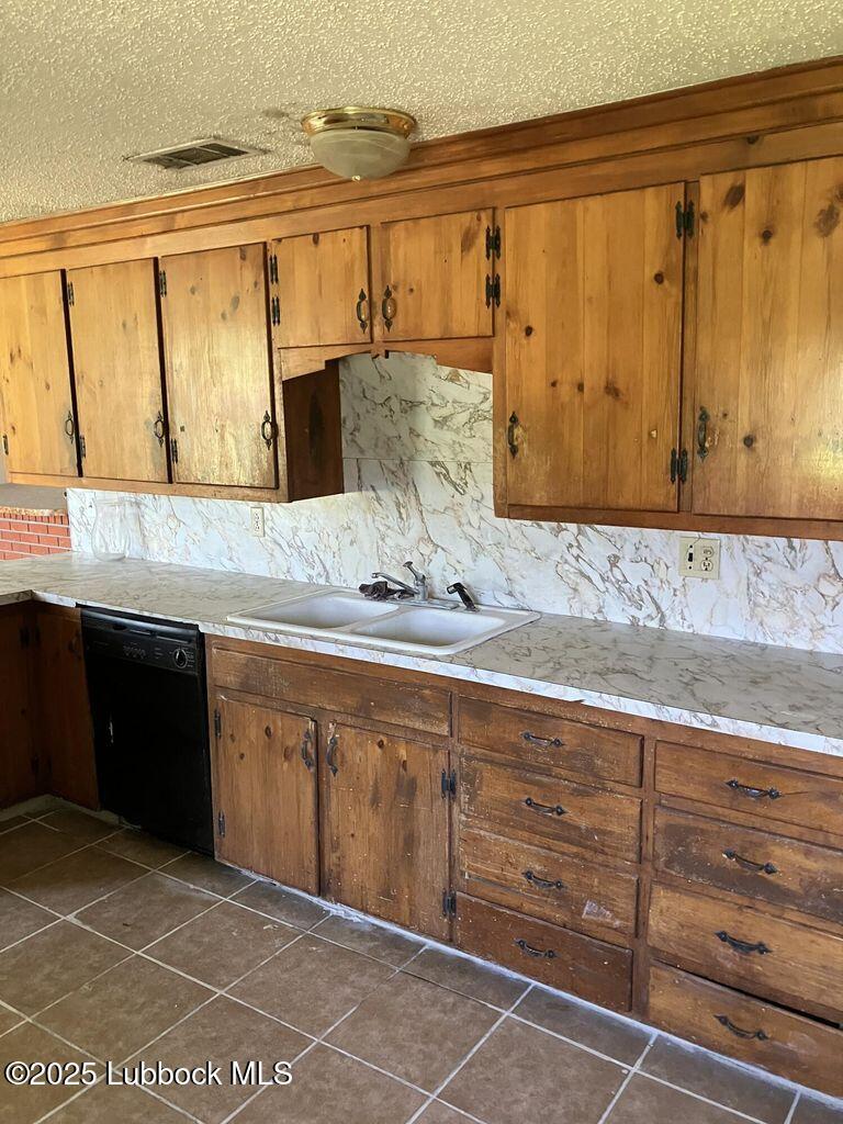1615 Utica Plainview, TX 79072 - Photo 9 of 26 a bathroom with a granite countertop sink and a mirror