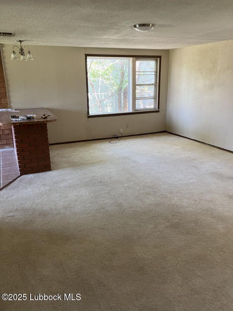 1615 Utica Plainview, TX 79072 - Photo 10 of 26 an empty room with windows