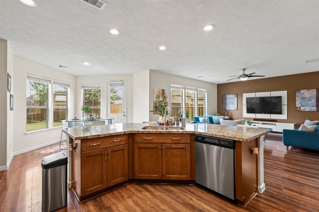 6719 Path Way Court Katy, TX 77449 - Photo 15 of 35 a kitchen with lots of counter top space sink and center island