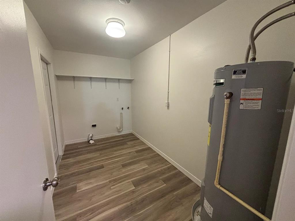 2413 Ave B Southwest, Unit A Winter Haven, FL 33880 - Photo 6 of 11 a view of a room with wooden floor