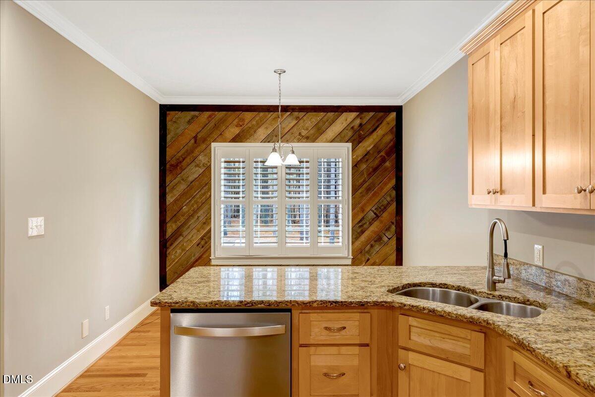 1635 Tommie Daniel Road Oxford, NC 27565 - Photo 12 of 63 a kitchen with granite countertop a sink and a window