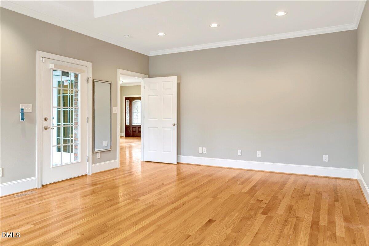 1635 Tommie Daniel Road Oxford, NC 27565 - Photo 17 of 63 wooden floor in an empty room with a window