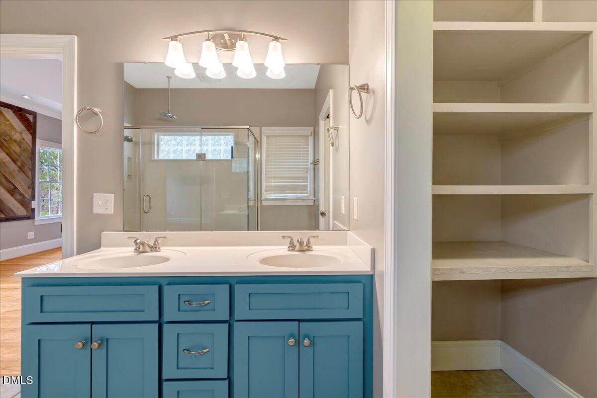 1635 Tommie Daniel Road Oxford, NC 27565 - Photo 19 of 63 a bathroom with a sink and a mirror