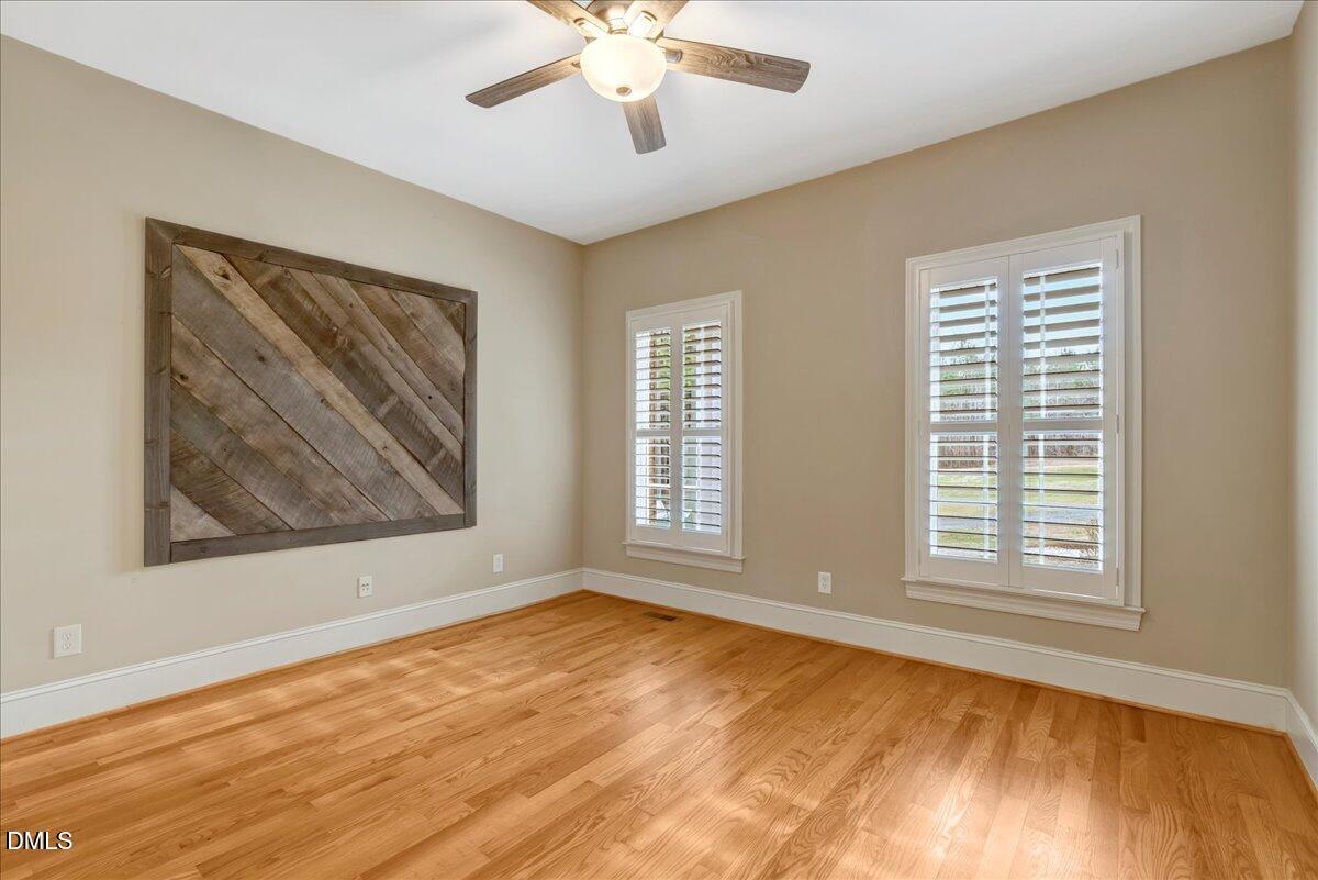 1635 Tommie Daniel Road Oxford, NC 27565 - Photo 24 of 63 a view of an empty room with wooden floor and a window