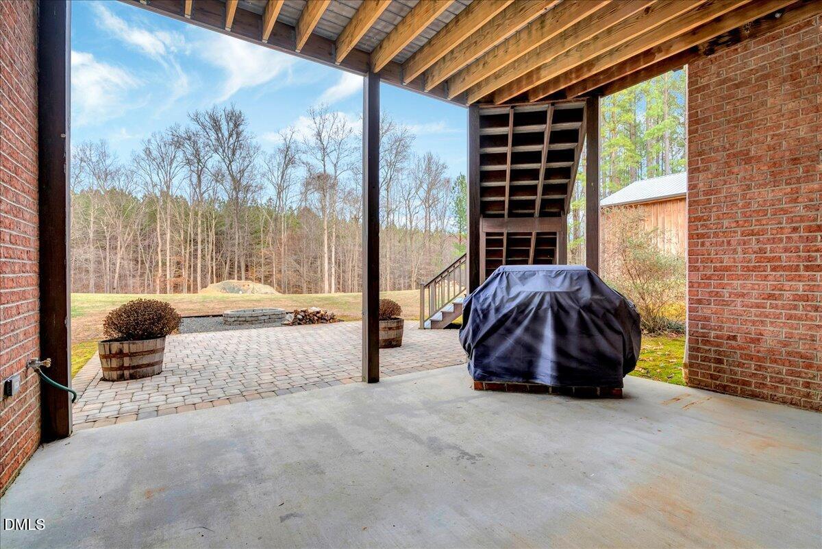 1635 Tommie Daniel Road Oxford, NC 27565 - Photo 45 of 63 a living room with furniture and a floor to ceiling window