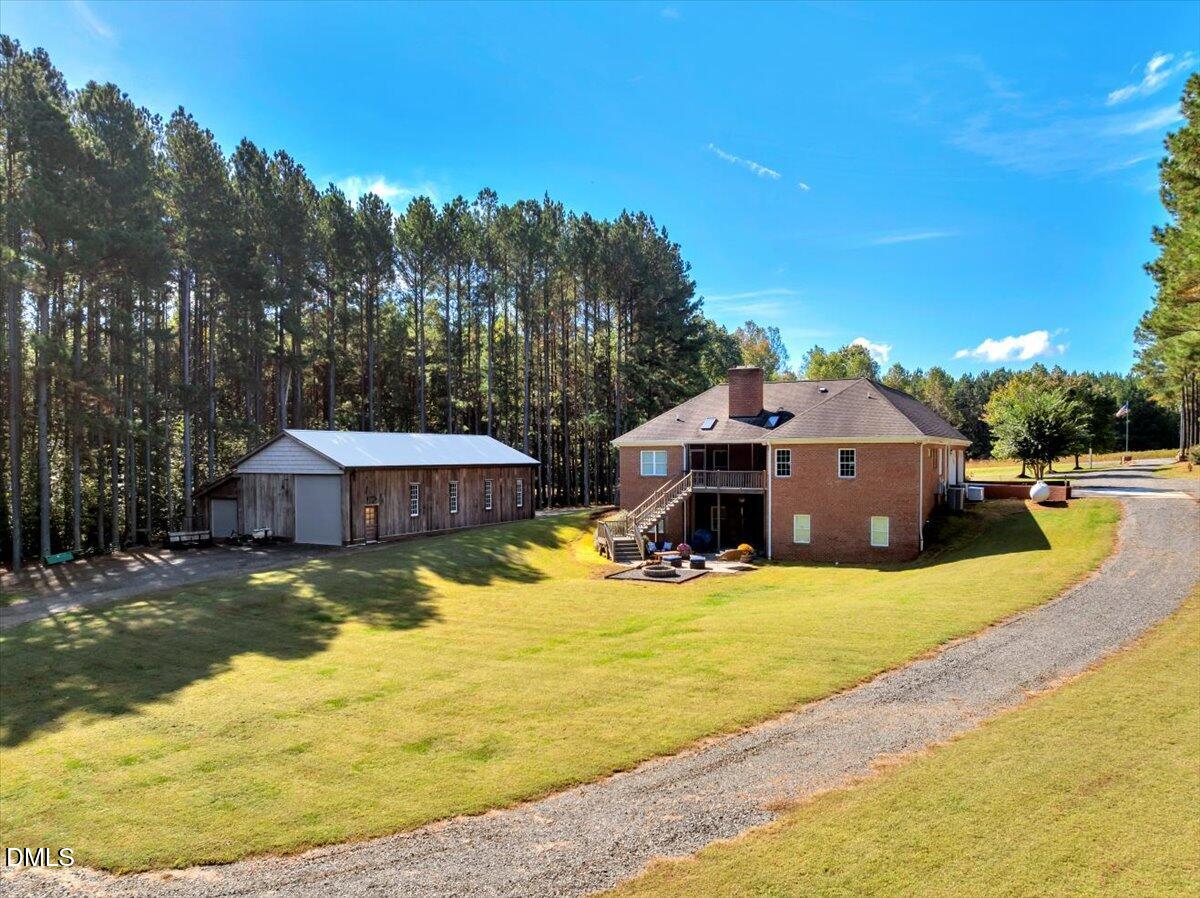 1635 Tommie Daniel Road Oxford, NC 27565 - Photo 49 of 63 a view of a house with swimming pool and sitting area