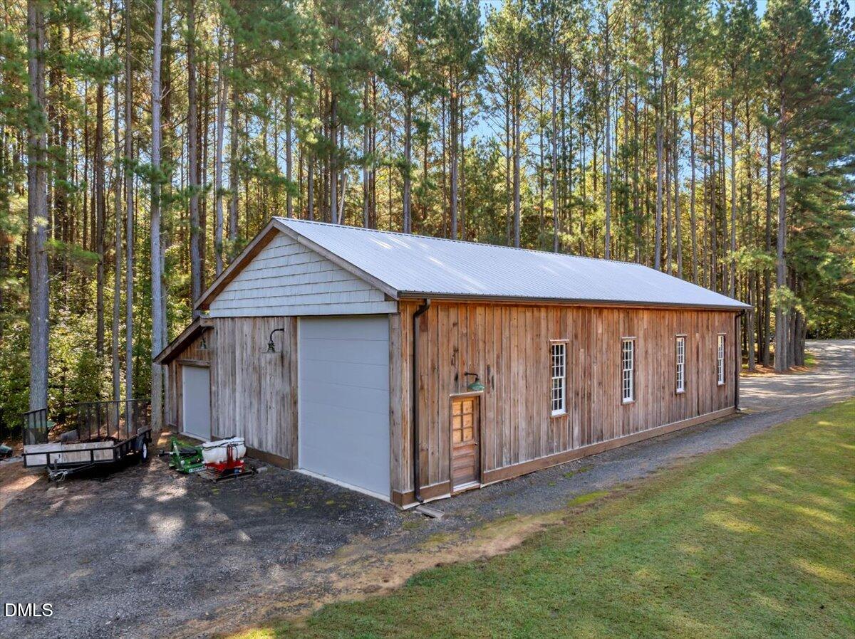 1635 Tommie Daniel Road Oxford, NC 27565 - Photo 50 of 63 a view of a house with a yard and wooden fence
