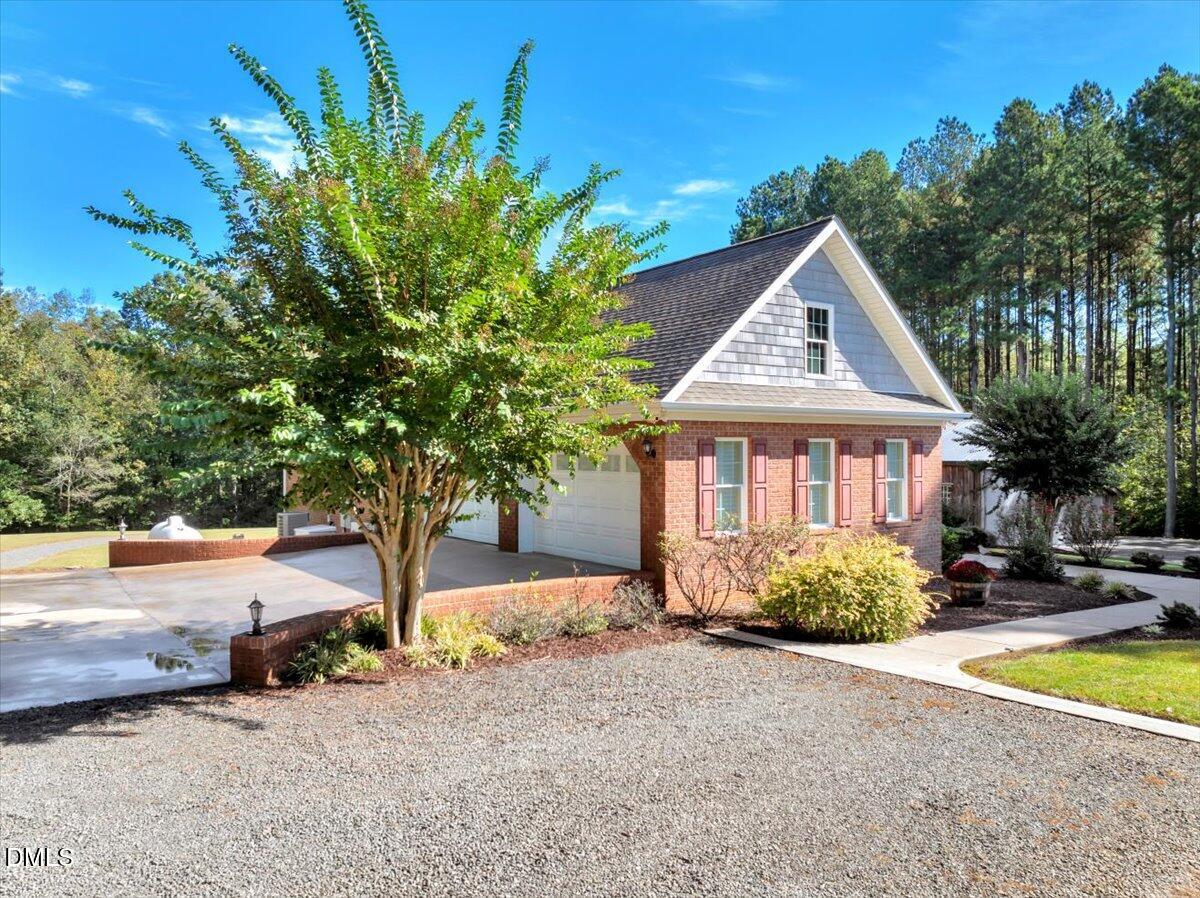 1635 Tommie Daniel Road Oxford, NC 27565 - Photo 52 of 63 a front view of a house with a yard
