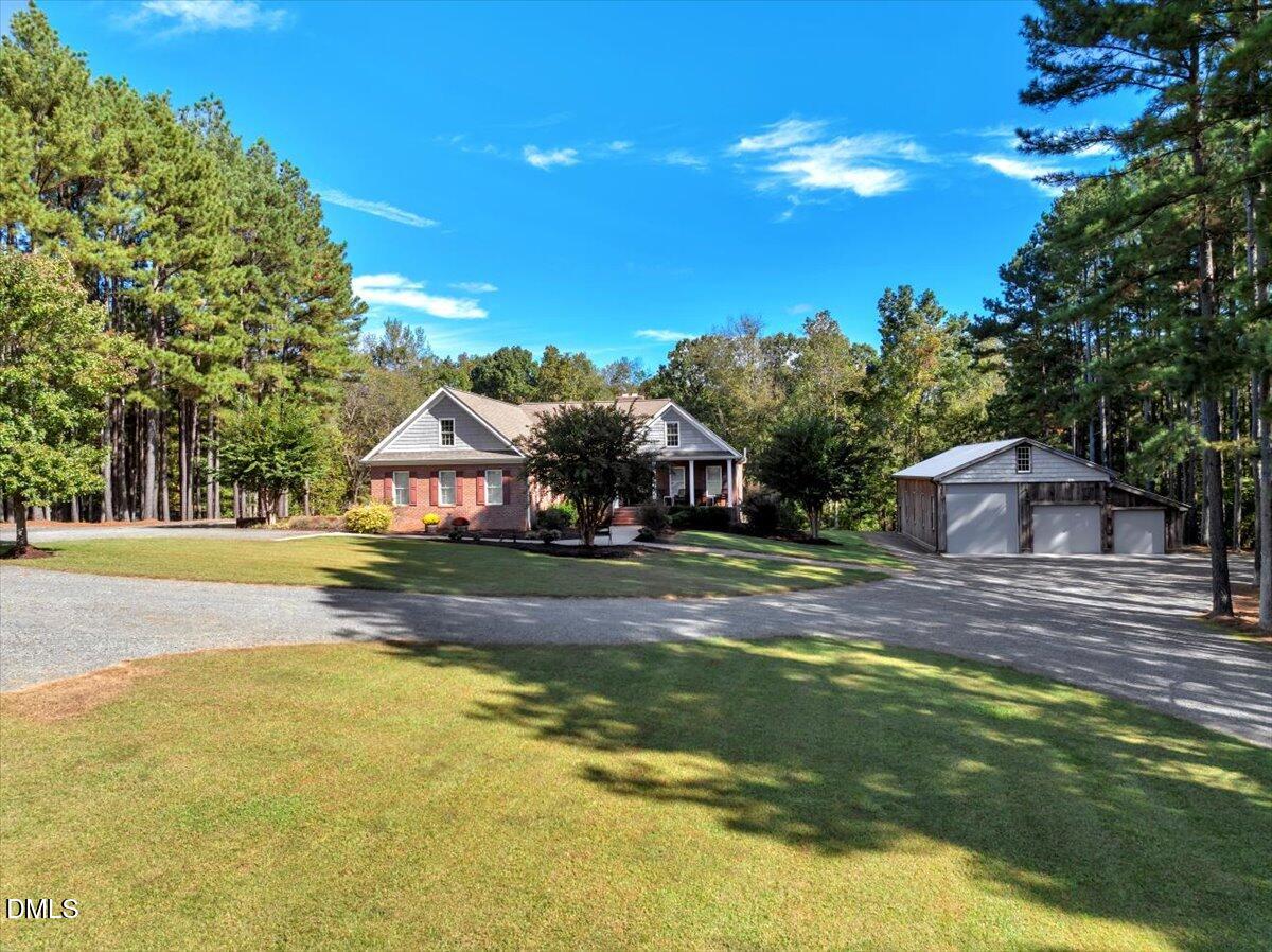 1635 Tommie Daniel Road Oxford, NC 27565 - Photo 54 of 63 a view of a house with swimming pool and a yard