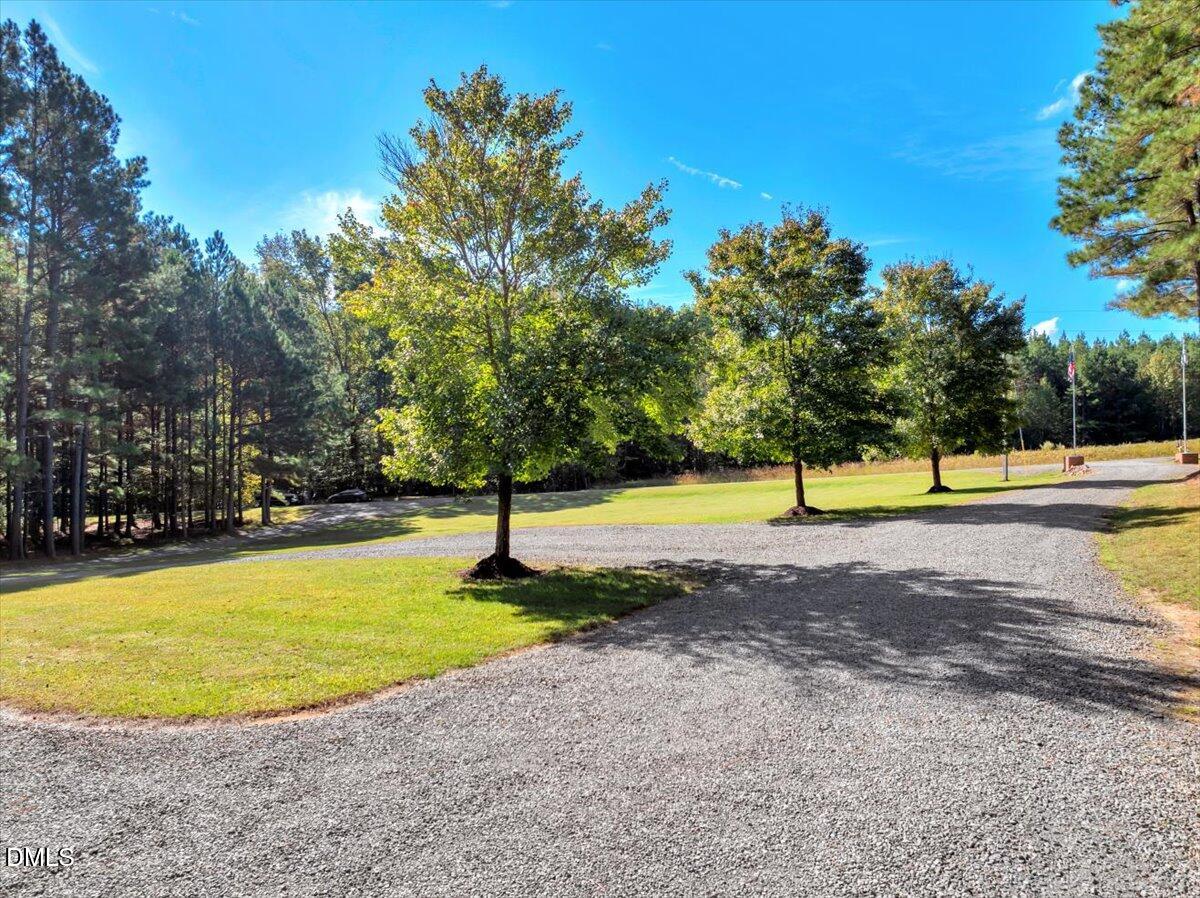 1635 Tommie Daniel Road Oxford, NC 27565 - Photo 56 of 63 a view of a swimming pool with a yard
