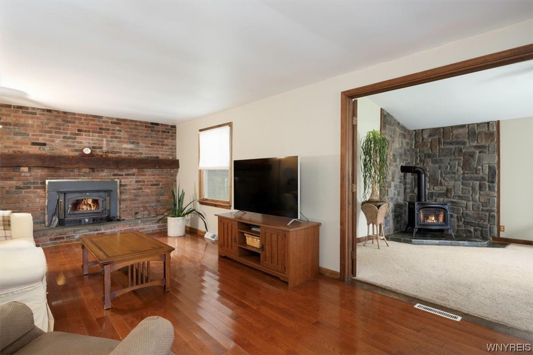 9186 Phillips Road Colden, NY 14080 - Photo 13 of 32 Greatroom with wood burning fireplace, red oak flo