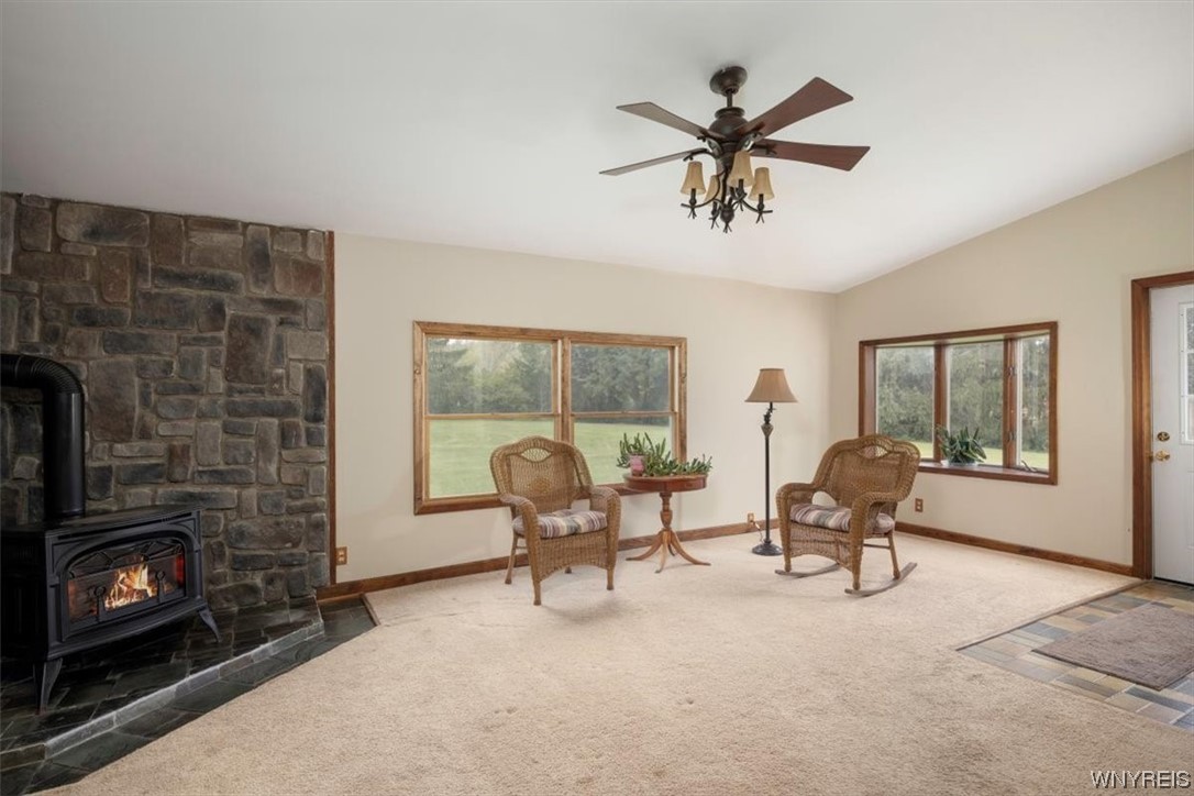 9186 Phillips Road Colden, NY 14080 - Photo 15 of 32 Familyroom with gas stove, views and doors to back