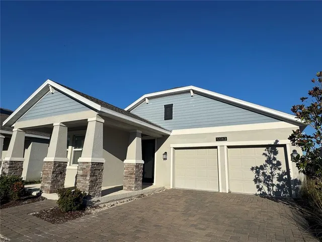 a front view of a house with a garage