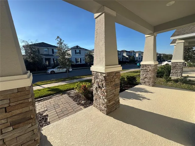 a view of a living room and kitchen