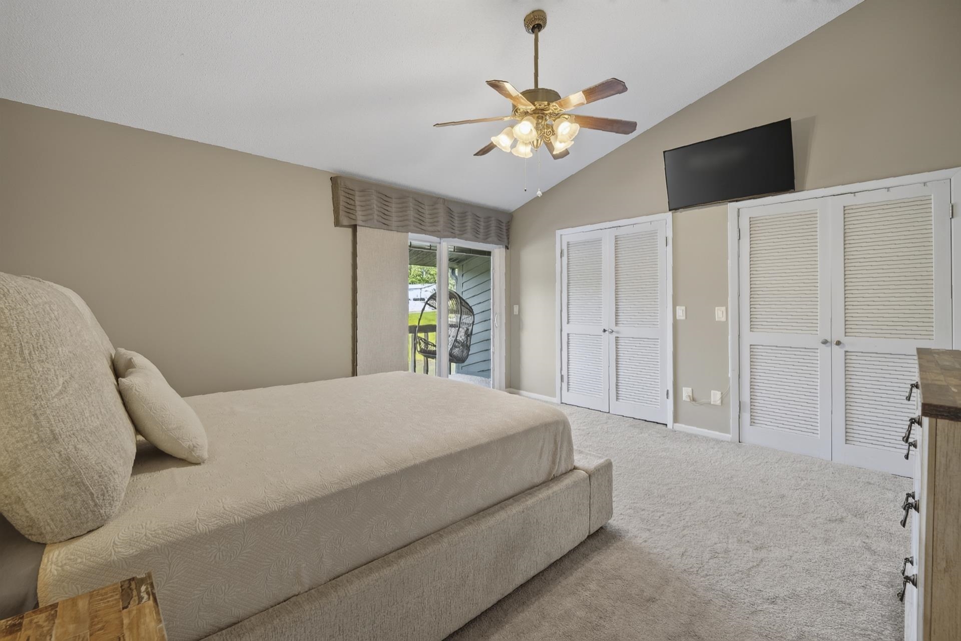 74 Driftwood Road Counce, TN 38326 - Photo 25 of 40 Vaulted ceiling room featuring light-colored carpeting and a ceiling fan with light fixture
