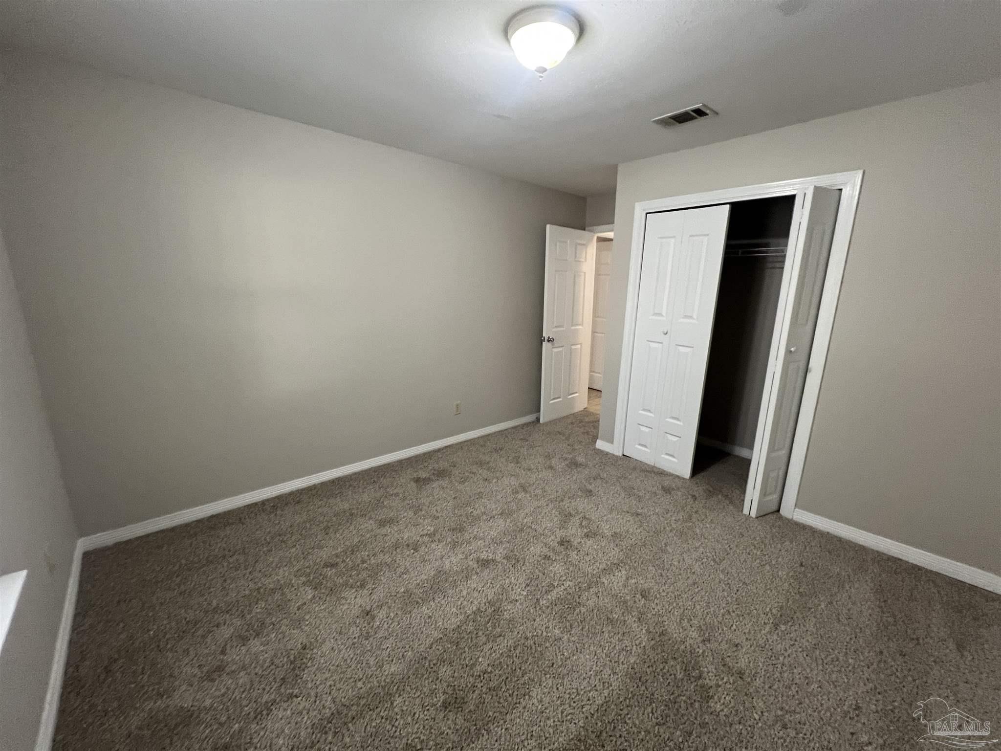 9485 Sunnehanna Boulevard Pensacola, FL 32514 - Photo 15 of 24 an empty room with closet