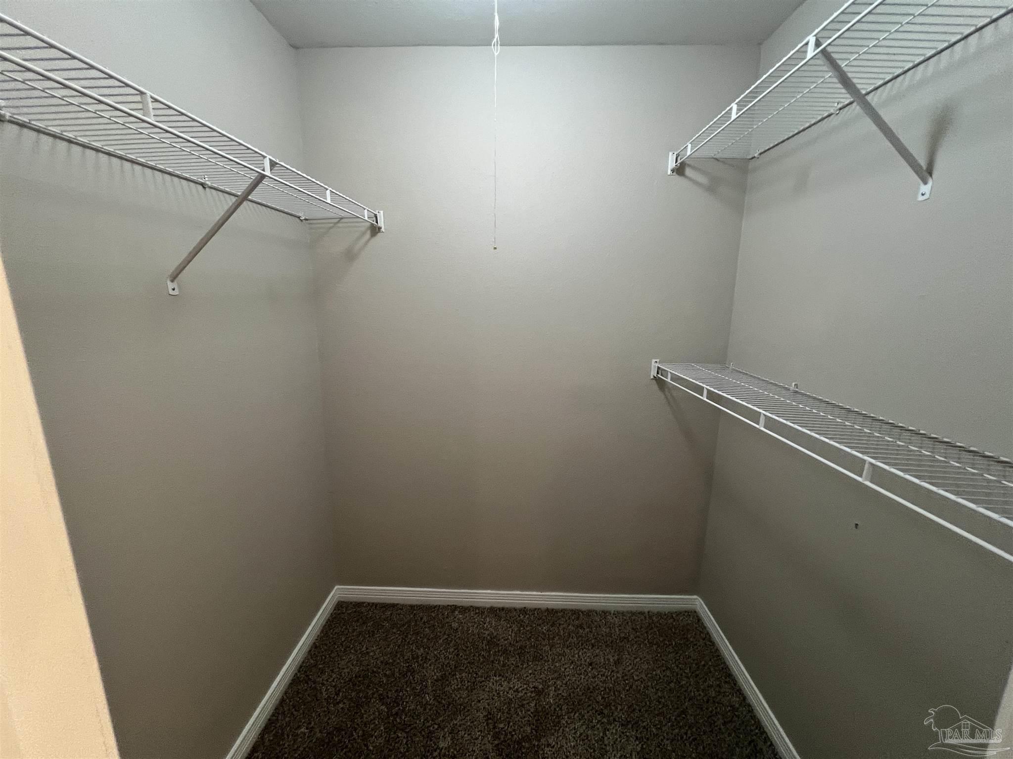 9485 Sunnehanna Boulevard Pensacola, FL 32514 - Photo 20 of 24 a view of a room with racks on the wall