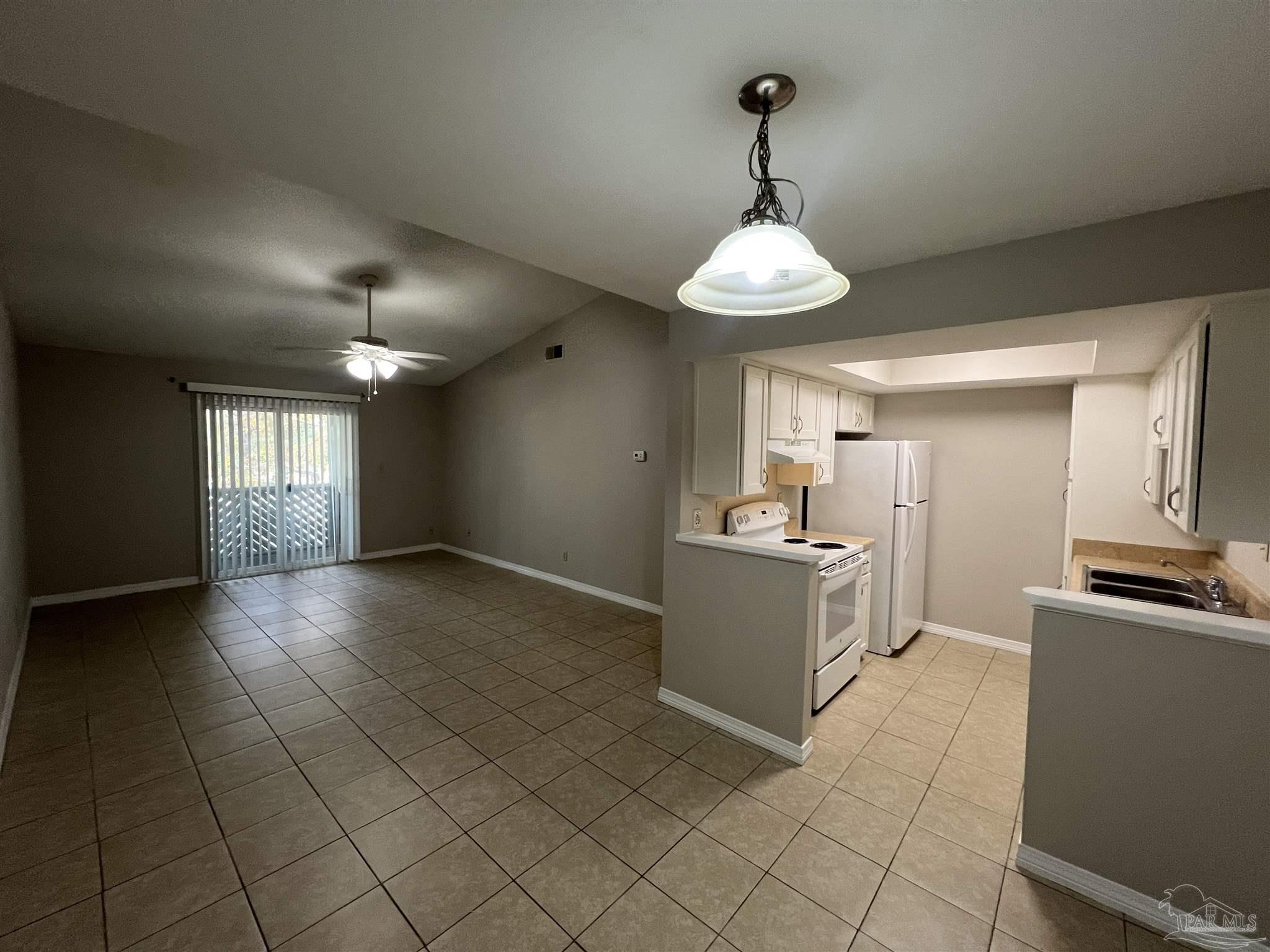 9485 Sunnehanna Boulevard Pensacola, FL 32514 - Photo 2 of 24 a kitchen with granite countertop white cabinets stainless steel appliances a sink and a window