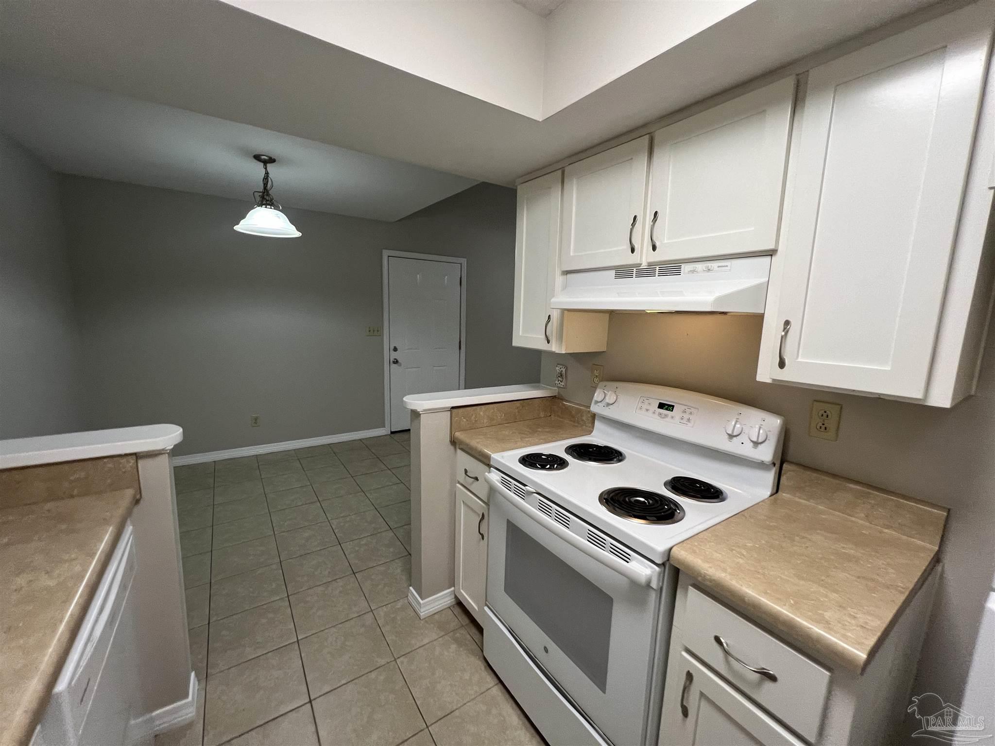 9485 Sunnehanna Boulevard Pensacola, FL 32514 - Photo 5 of 24 a kitchen with cabinets and appliances