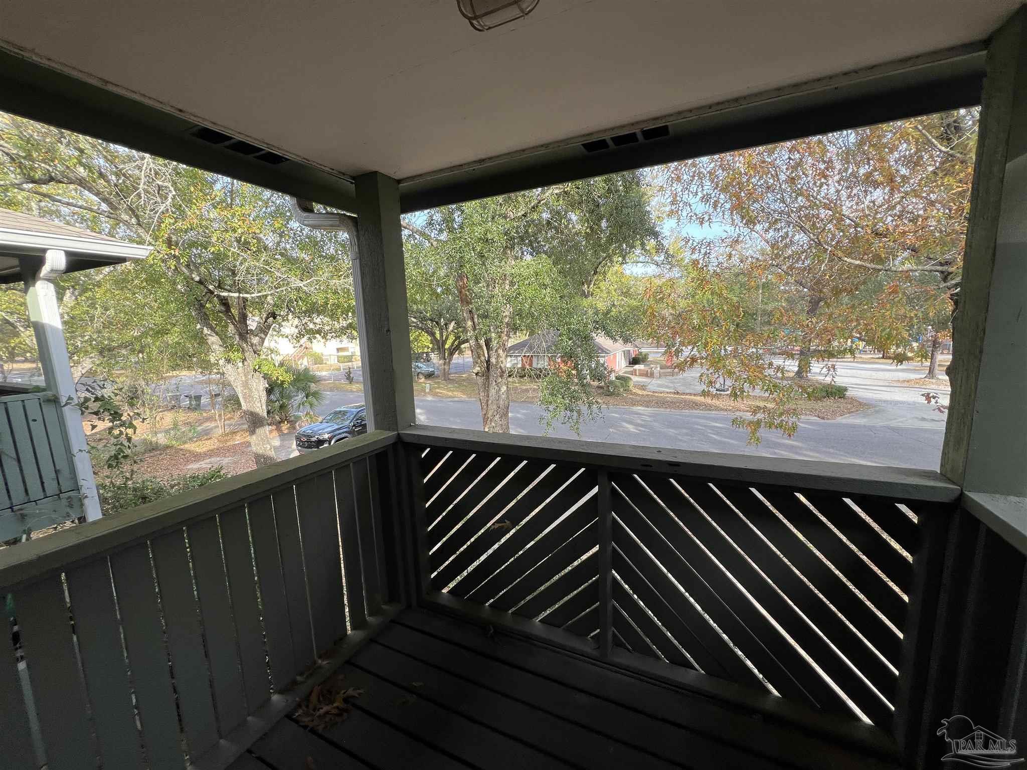9485 Sunnehanna Boulevard Pensacola, FL 32514 - Photo 7 of 24 a view of a balcony with wooden floor