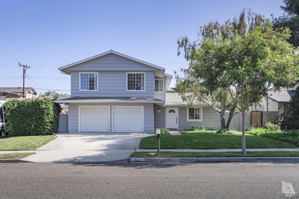 864 Appleton Road Simi Valley, CA 93065 - Photo 1 of 32 a front view of a house with a garden and garage