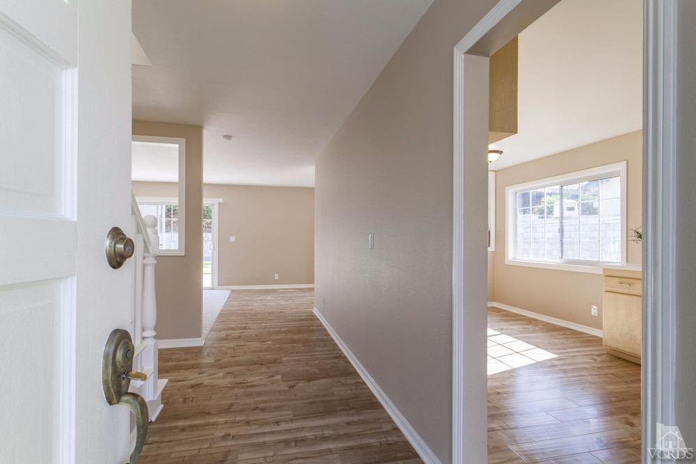 864 Appleton Road Simi Valley, CA 93065 - Photo 2 of 32 a view of a hallway view with wooden floor and staircase
