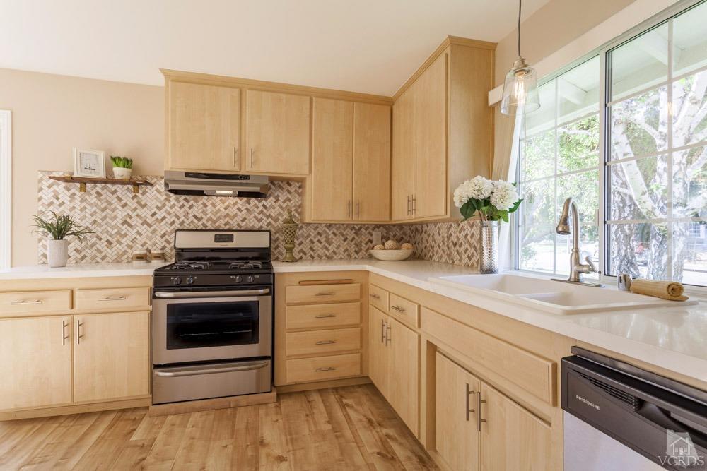 864 Appleton Road Simi Valley, CA 93065 - Photo 11 of 32 a kitchen with a stove and a sink